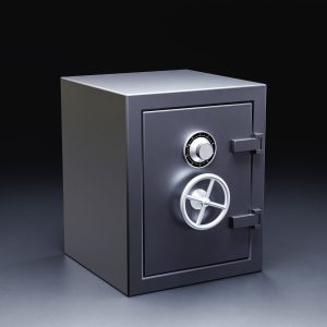 Large steel safe with secure locking system on dark gray surface